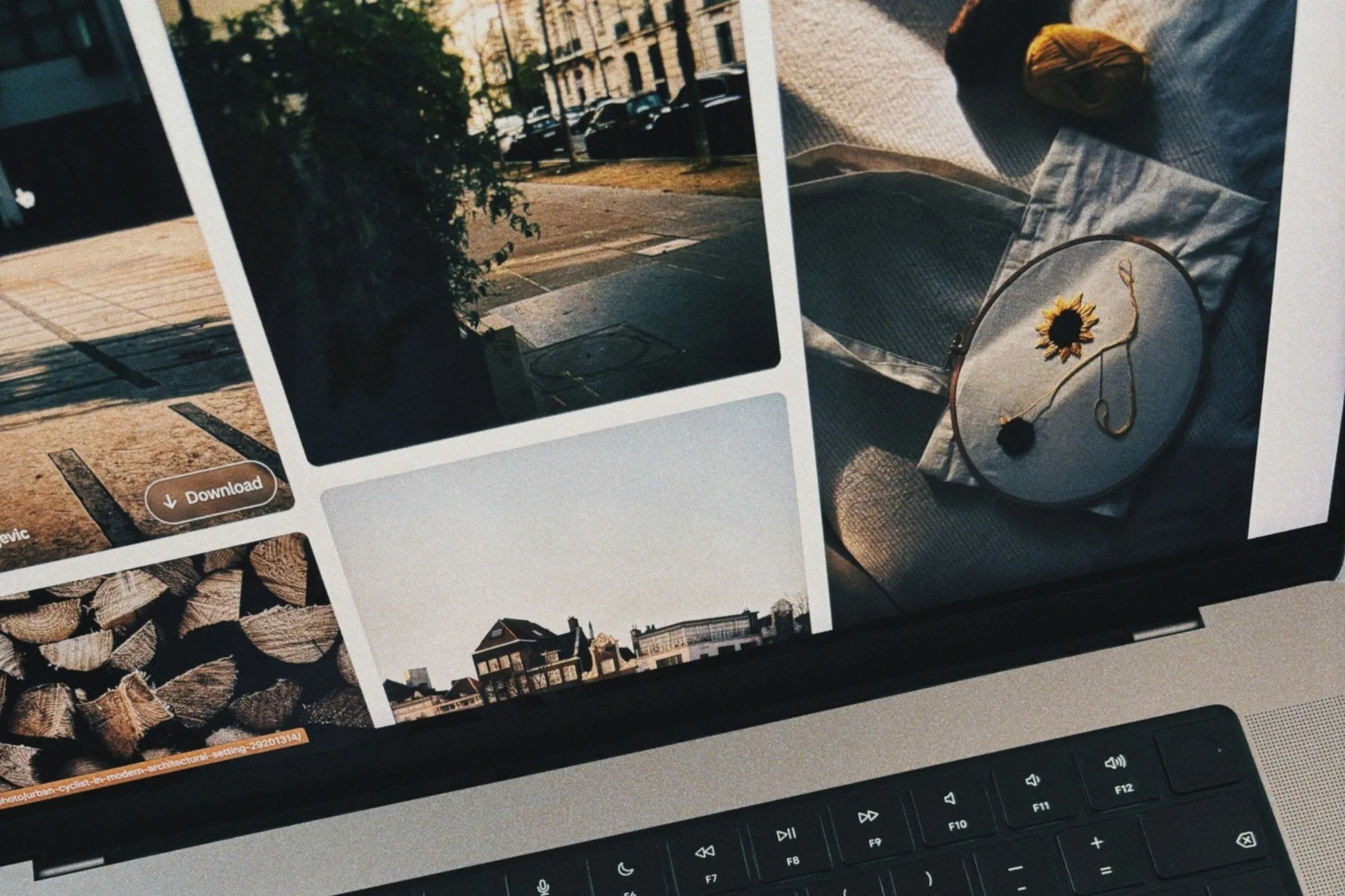 A laptop screen showing a grid of images